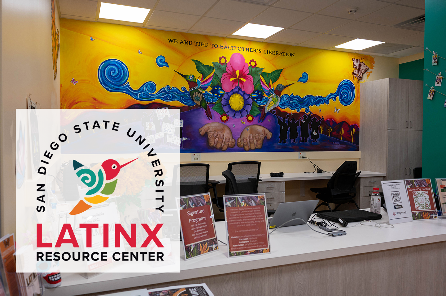 latinx resource center welcome desk with mural